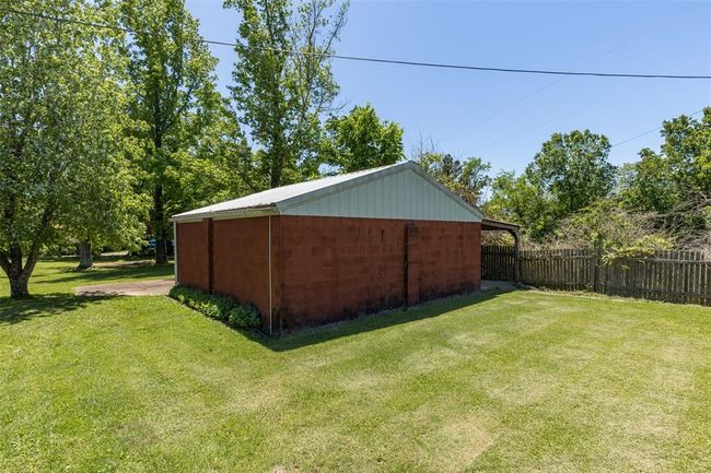 View of yard featuring an outbuilding | Image 12