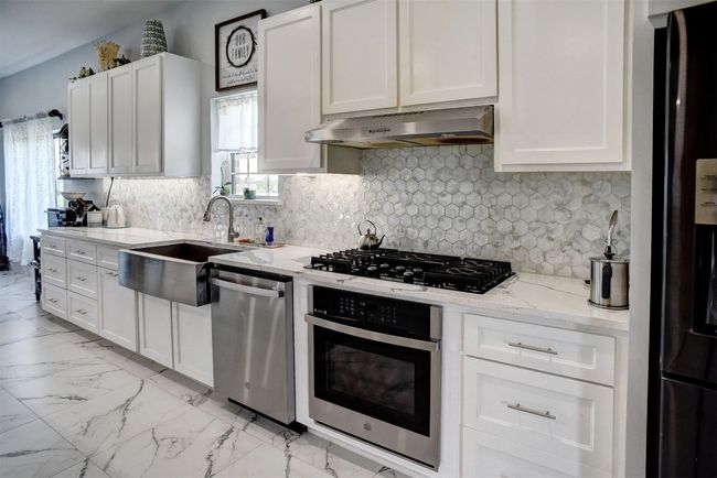 Another view of kitchen counter. Gas stove | Image 18