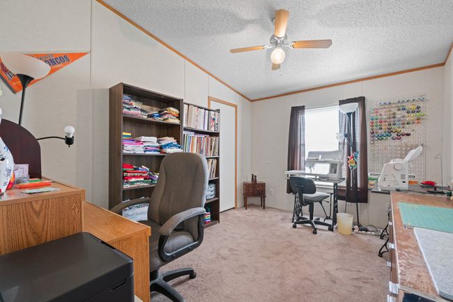Bedroom #2 currently used as an office and sewing room | Image 22