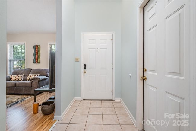 Entry hall and door to garage on the right | Image 5