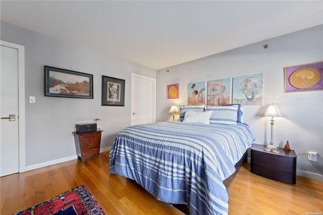 Bedroom featuring hardwood / wood-style floors | Image 4