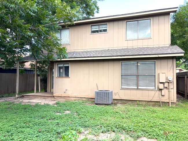 Rear view of house with roof with shingles | Image 19