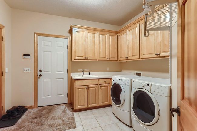 The main floor laundry which is right off the 3 car garage for convenience. | Image 14