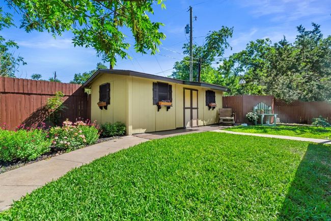 A large storage shed in the backyard gives you a place to keep tools, bikes, lawn equipment, or seasonal decorations. | Image 30