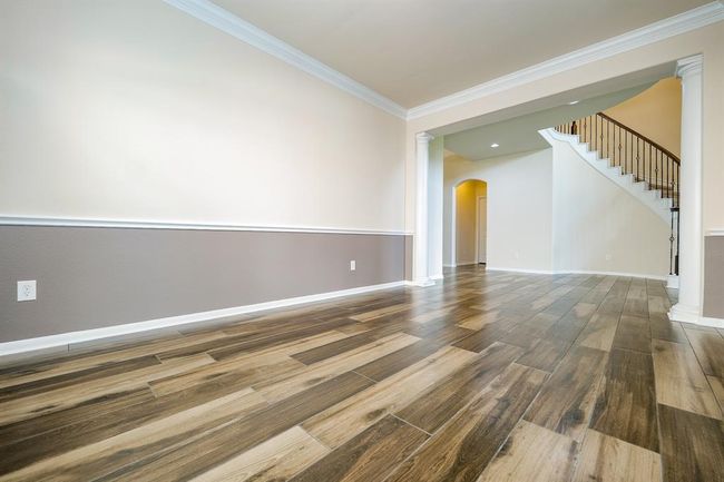 Choose a little privacy or invite everyone into your special formal dining space, with an open view into the main hallway/foyer and grand staircase. | Image 6