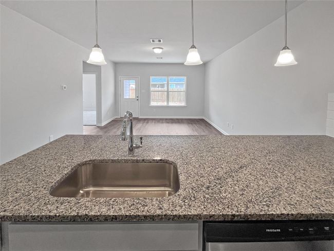 The Sparrow II- Kitchen into Family Room. Home under construction. Sample floor plan photo used for illustrative purposes only. Upgrades, selections options, windows and colors may vary. | Image 8