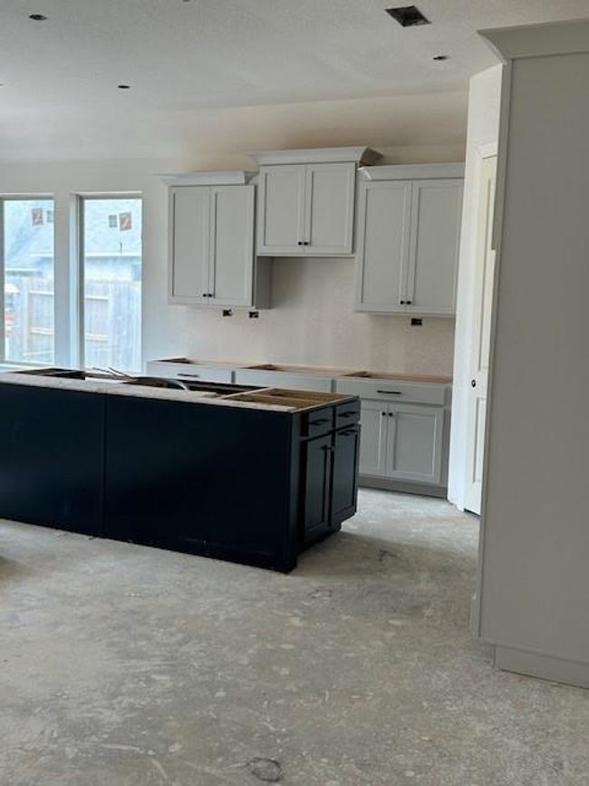 Combination light and dark cabinets for a dramatic look. | Image 5