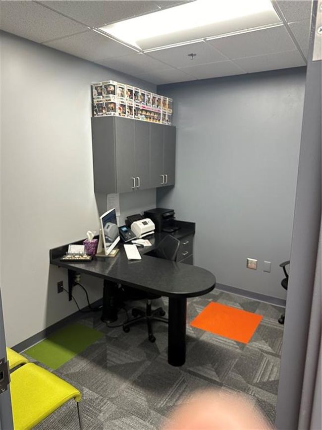 Carpeted office with a paneled ceiling | Image 7