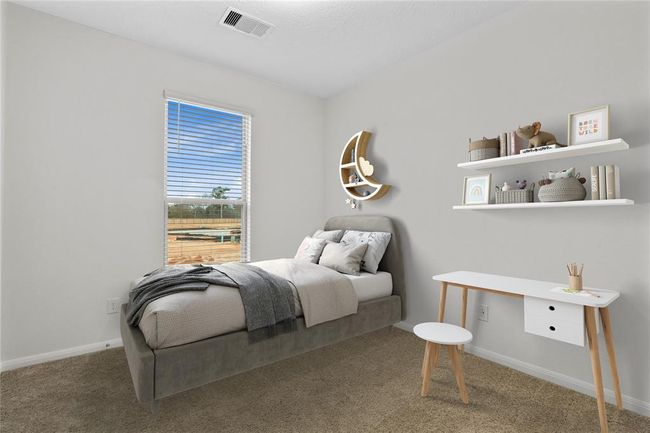 Secondary bedroom features plush carpet, high ceiling and a large window with privacy blinds. | Image 7