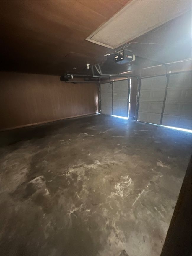 Garage with a garage door opener | Image 14