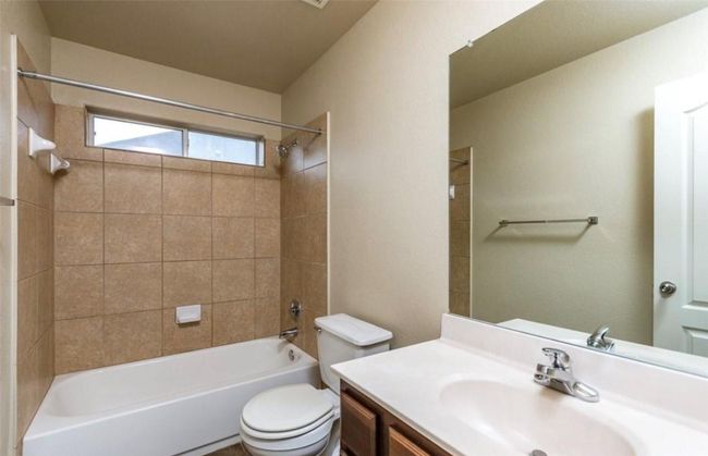Full bathroom featuring vanity, toilet, and shower / bathtub combination | Image 25