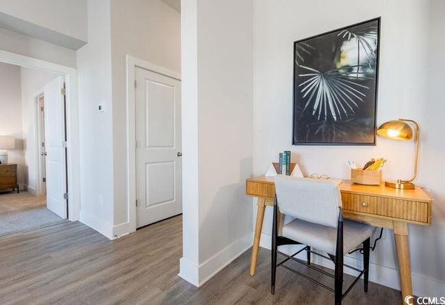 Office area featuring baseboards and wood finished floors | Image 11