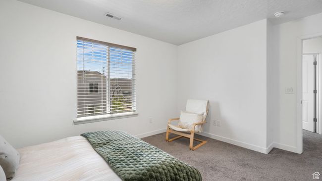 Carpeted bedroom featuring baseboards | Image 21