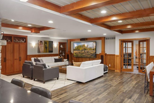 Spacious Lower Level Family Room with High-End Television | Image 39