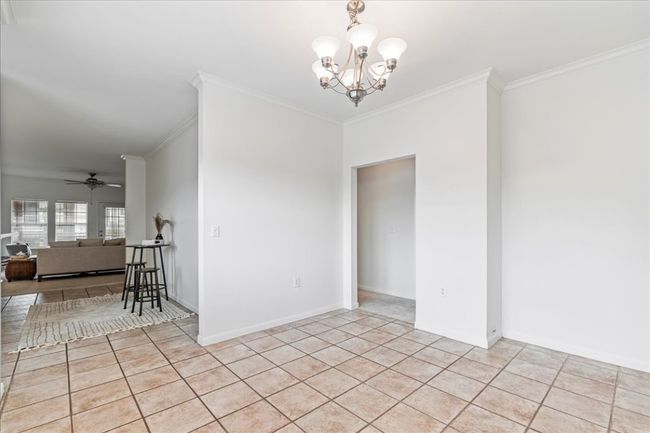 A chandelier completes the formal dining. | Image 14