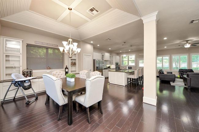 DINING AREA WITH CUSTOM BREAKFAST BAR AREA AND STORAGE AREA | Image 10