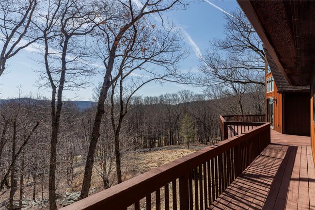 Deck featuring a forest view | Image 4