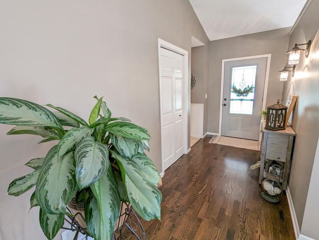 Welcoming entry with hardwood floors! | Image 13