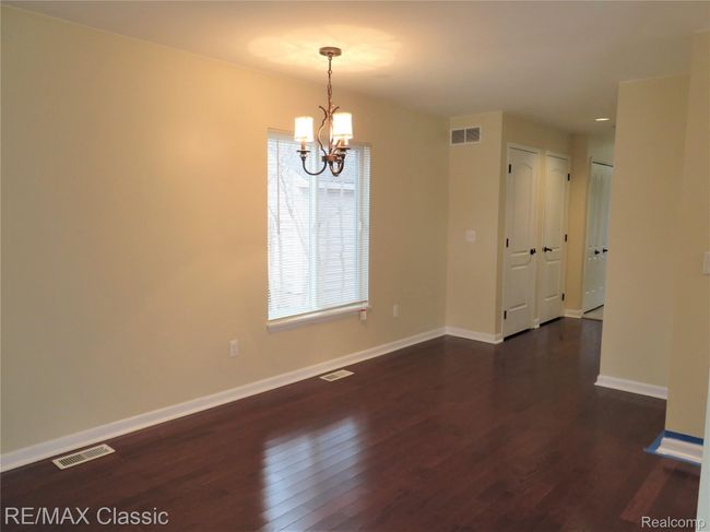 Dining room flaunts wood floors. | Image 12