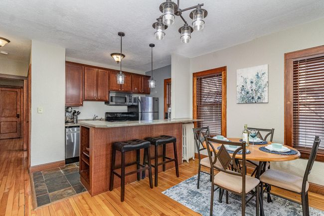Cherry cabinetry w/SS appliances & breakfast bar! | Image 5