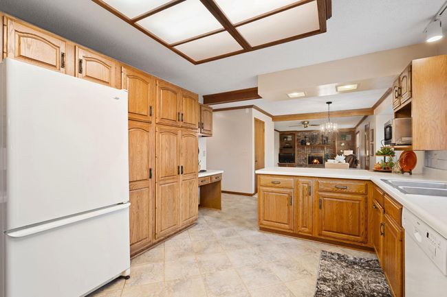 Kitchen view of pantry and desk area | Image 11