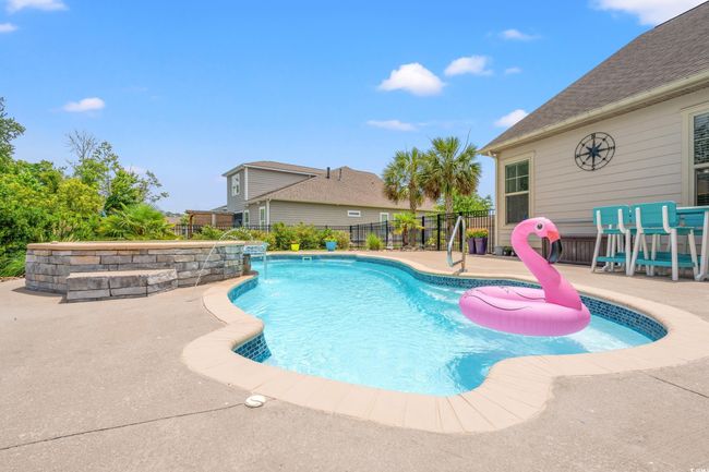 View of pool with a patio | Image 33