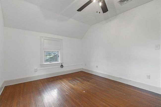 Additional living space with lofted ceiling, ceiling fan, dark wood-type flooring, and baseboards | Image 41