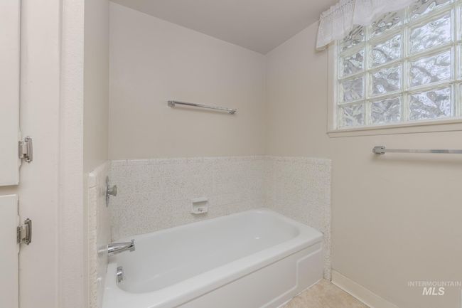 Bathroom featuring a bath | Image 24