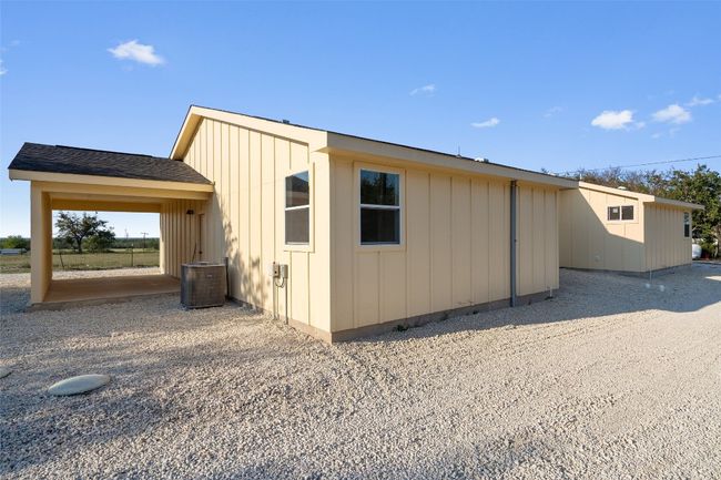 View of property exterior featuring board and batten siding | Image 17