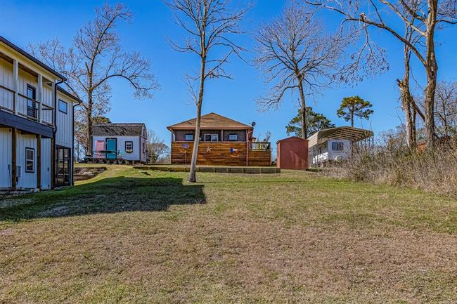 This view is from the bottom of the adjacent lot. Sellers are selling this lot with the house so the new owners can still enjoy the view without fear of someone building in front of this home. | Image 31