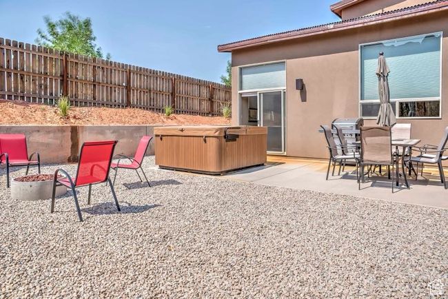 View of patio / terrace featuring a hot tub | Image 22