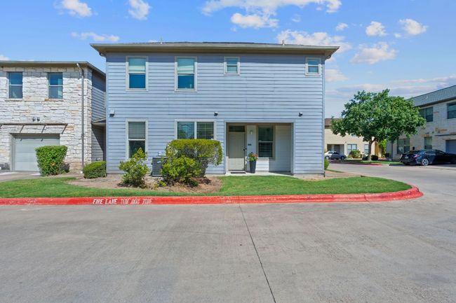 Multi unit property featuring a front lawn | Image 30