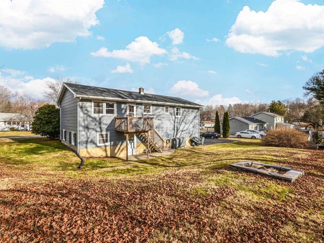Rear view of property with a lawn and a wooden deck | Image 31