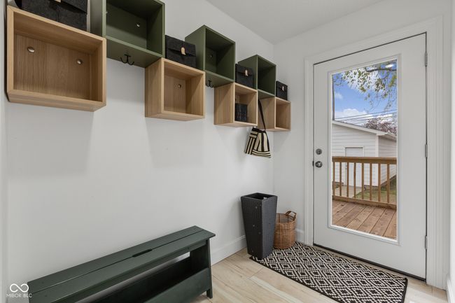 mudroom featuring light wood-type flooring, baseboards, and plenty of natural light | Image 54