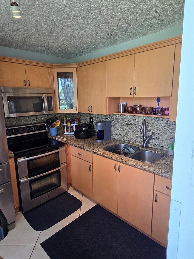 Remodeled Kitchen With Newer Appliances And Granit Tops | Image 51