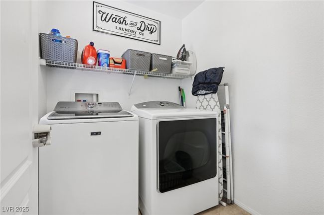 Laundry room with washing machine and dryer and baseboards | Image 36