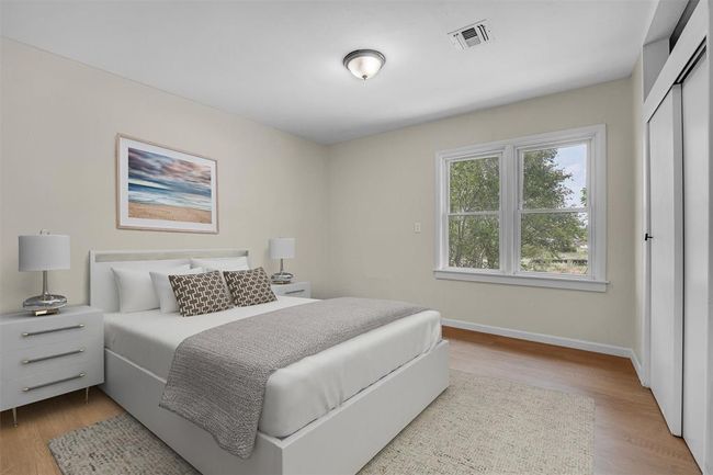 Bedroom featuring hardwood / wood-style flooring and a closet | Image 32