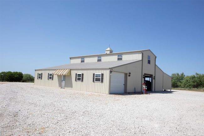 Back of property featuring a detached garage | Image 26