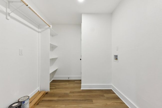 Walk in closet featuring light wood-style floors | Image 20