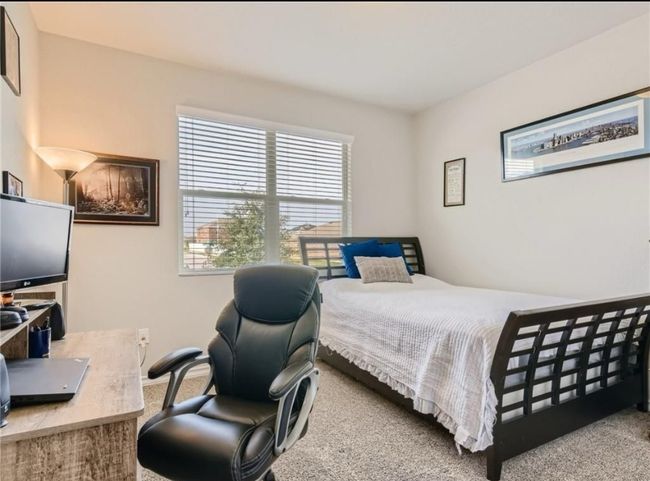 View of carpeted bedroom | Image 11