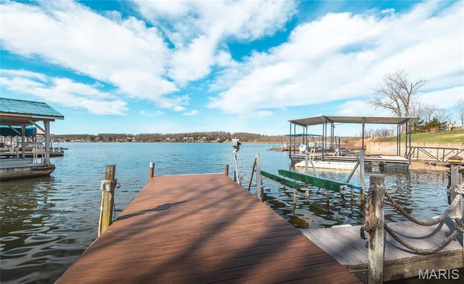 View of dock featuring a water view and boat lift | Image 49
