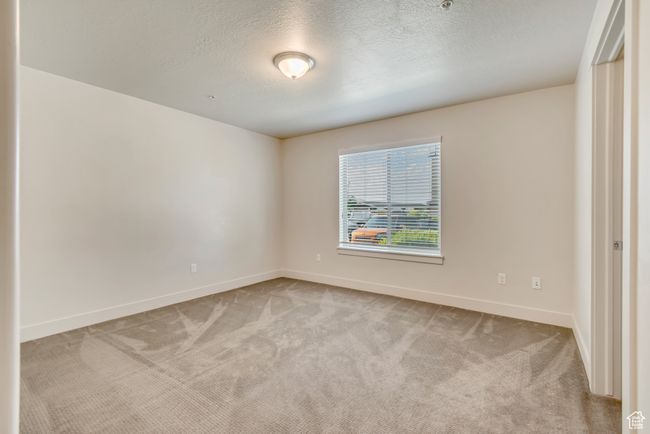 Spare room with light colored carpet and a textured ceiling | Image 17