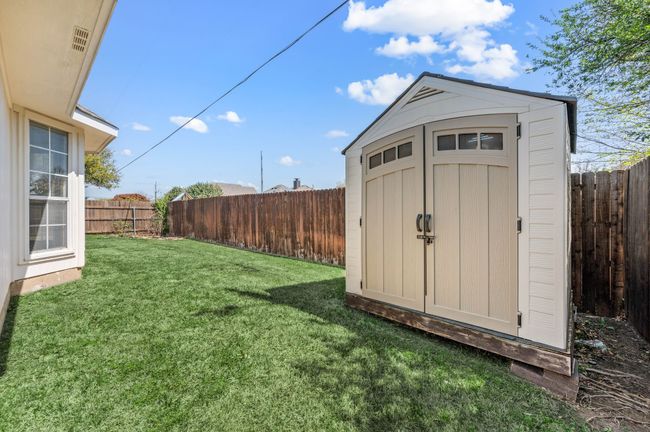 View of shed with a fenced backyard | Image 37