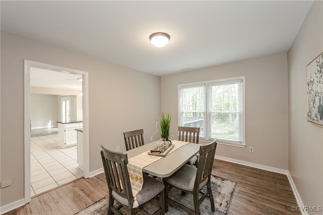 Dining space with baseboards and light wood-type flooring | Image 18