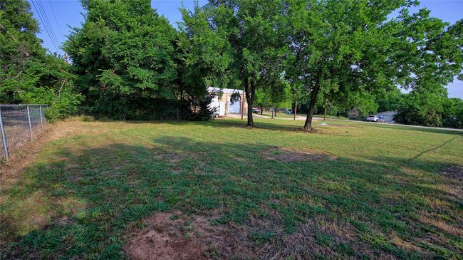 View of yard. Lot 5 & 6 with building in the background | Image 14