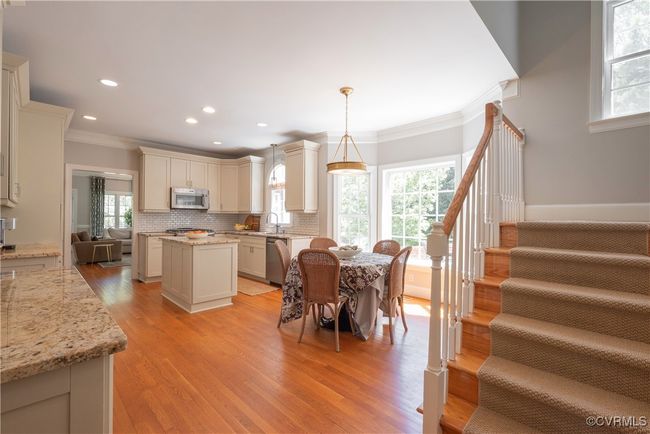 Dining space with recessed lighting, plenty of natural light, stairway, and ornamental molding | Image 21
