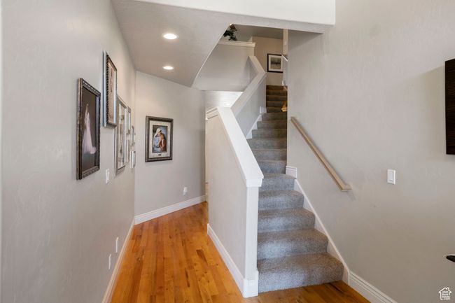 Staircase featuring wood finished floors and recessed lighting | Image 18