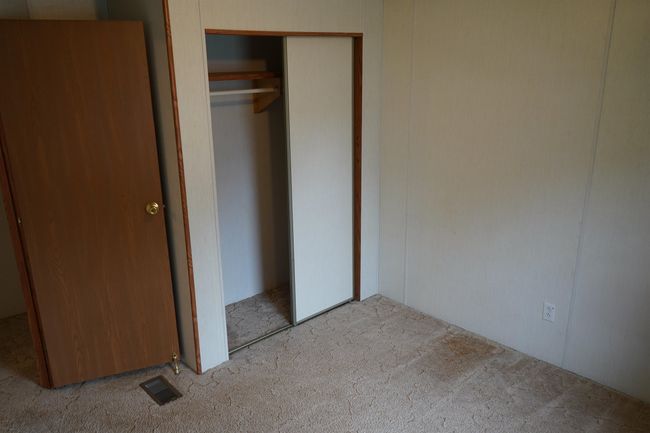Unfurnished bedroom featuring carpet flooring and a closet | Image 16