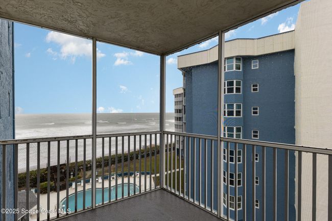 Private balcony with ocean and pool views off guest bedroom | Image 27