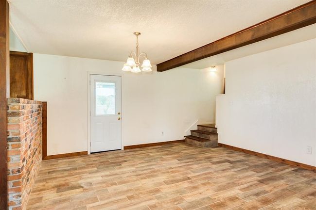 Dining Area toward side door outside. | Image 25
